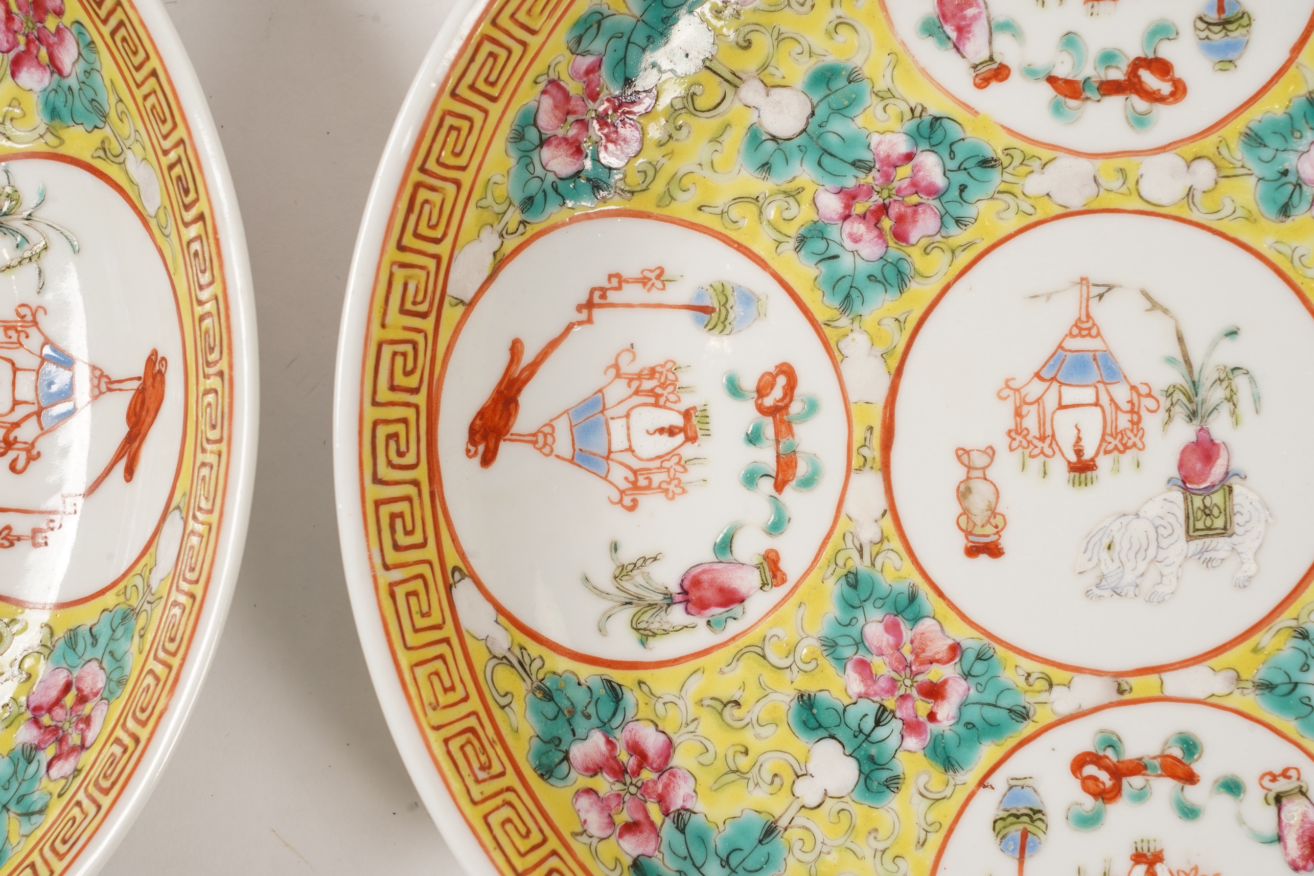 A pair of Chinese yellow ground medallion saucer dishes, Guangxu six character marks, early 20th century